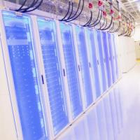 A photograph of the Hive cluster supercomputer with blue LED lights