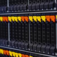 The image of a computer in a data stack with yellow and orange tabs
